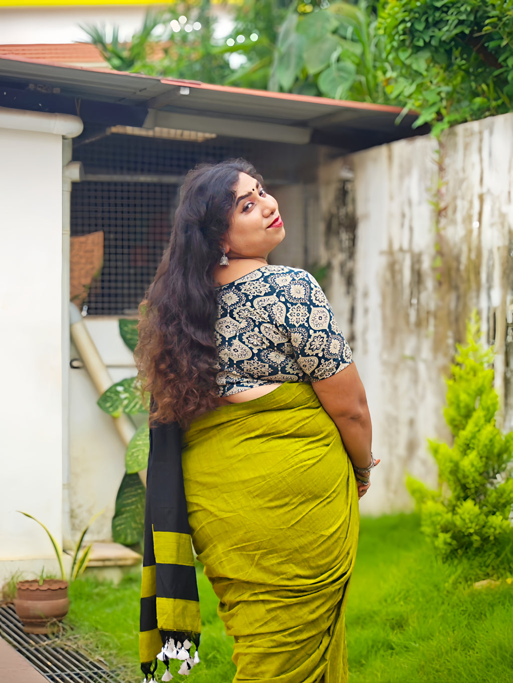 Back view of Mustard Yellow Khadi Cotton Saree with black border and Black Running Blouse by Vyra Fashion, showcasing the pallu design.
