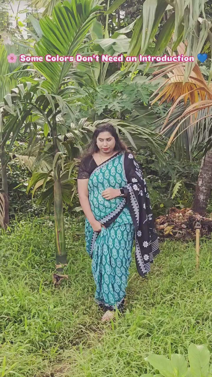 Teal Blue Printed Cotton Mulmul Saree with Black Contrast Border