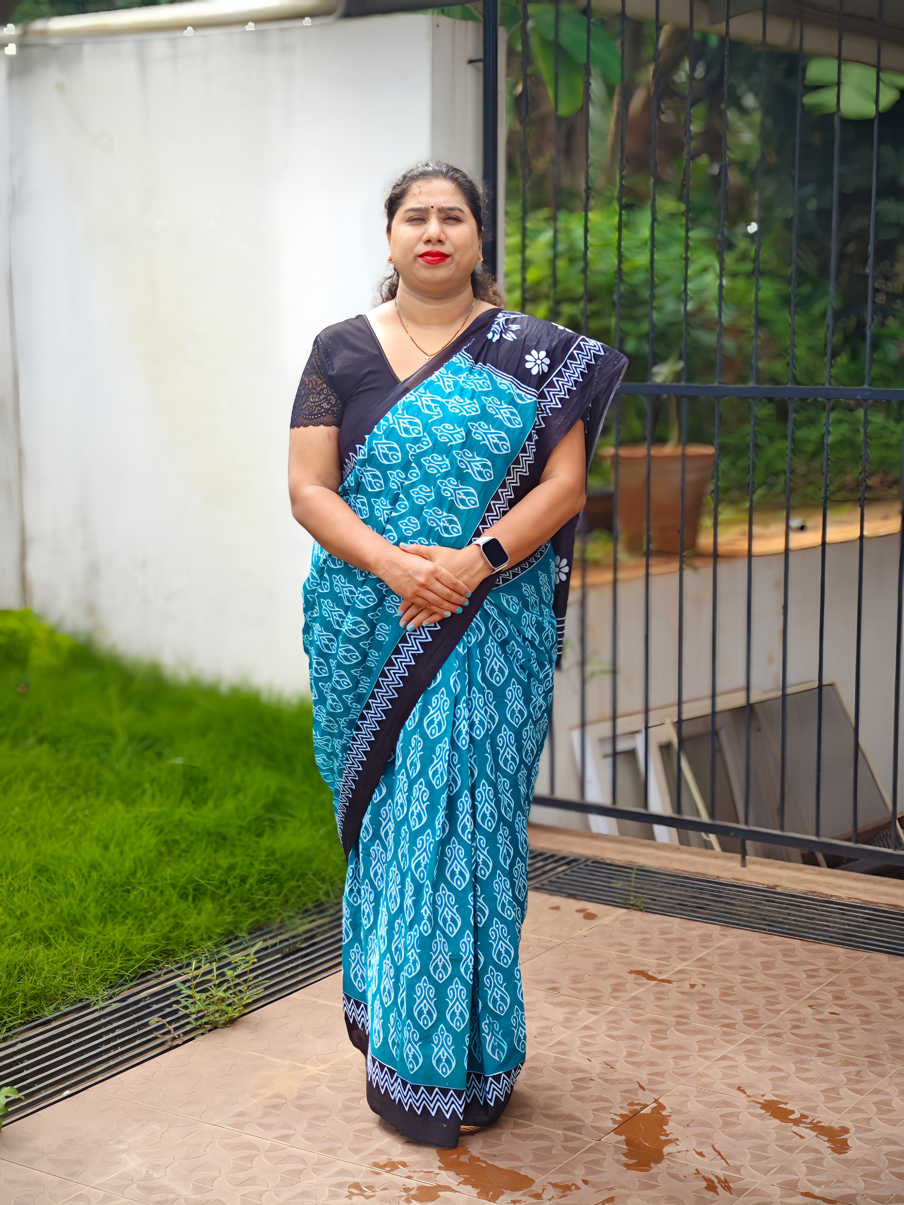 Teal Blue Printed Cotton Mulmul Saree with Black Contrast Border